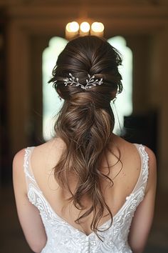 the back of a woman's head wearing a wedding dress