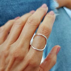 This ring is becoming my favorite very quickly! This minimalist large circle ring design goes well with everything I wear and has that effortless chic look. It is very comfortable to wear as it hugs your index finger in a very delicate and soft way. The width of the circle is about 1 inch. If you need a smaller circle, please contact me and I will be happy to make it for you. I let the smooth finish of the natural sterling silver shine and just hammered the band which is a bit thinner that the c Silver Hammered Minimalist Midi Rings, Everyday Minimalist Hammered Midi Rings, Modern Nickel Free Stackable Rings, Nickel-free Minimalist Midi Rings, Modern Handmade Stackable Rings For Everyday, Handmade Simple Midi Rings, Modern Nickel-free Open Midi Rings, Handmade Minimalist Rings For Everyday, Minimalist Open Circle Midi Rings For Everyday