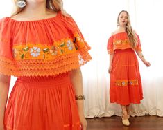 Charming bright cayenne pepper orange cotton gauze folk dress from Mexico. Easy slip-on fit with a smocked waist, and elastic neckline that can easily be worn around your shoulders. Contrasting crochet trim, satin ribbon, and hand-embroidered details. Excellent condition Size // fits like a S-M Label // no tags Material // cotton Length // 44 inches Bust // stretches to 40 inches Waist // 24 to 32 inches comfortably Hips // free Sleeve // 11 inch shoulder ruffle ❦ Happy to help with any question Orange Mexican Dress, Spring Hippie Orange Dresses, Orange Summer Dress With Lace Trim, Orange Lace Trim Summer Dress, Summer Orange Dresses With Lace Trim, Orange Hippie Summer Dresses, Orange Embroidered Summer Dress, Orange Embroidered Bohemian Dress, Orange Bohemian Embroidered Dress