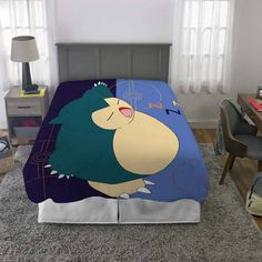 a bed with an image of a cartoon character on it's cover and pillow