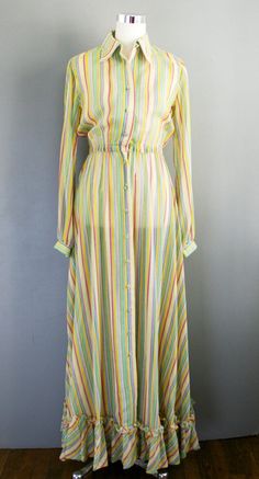 "This Betty Carol dress is of a semi sheer cotton organza in a happy yellow stripe. It is in great ready to wear condition , fresh and clean, as is without holes, stains, or tears. The yellow belt is not original and is not included. Marked size 10 36\" bust 24-34\" elastic waist full hip 45\" waist to hemline Purveyor's Note: We have searched far and wide, wrestled bears, braved the cold, traversed mountain ranges, fought pirates, swam with sharks and eaten at many a questionable road side taco Yellow Button-up Dress For Daywear, Carol Dress, Hostess Dresses, Yellow Belt, Shirtwaist Dress, Summer Stripes, Spring Floral Dress, Striped Maxi, Yellow Stripes