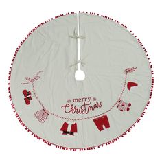 a white christmas tree skirt with red pom - poms and merry lettering on it