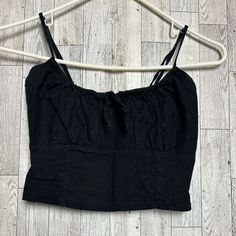 A Gently Used Crop Top! There Is No Damage (Rips,Snags,Stains,Etc) Reasonable Offers Accepted Instantly! Bundle & Save! Bundle Deals Will All Arrive In The Same Package. Items Are Pallet Pulls And May Have Sticker Residue Or Missing The Original Stickers! Products Are Not Used!! Shipping Is By Weight And The Prices Are Preset By The Selling Platform. All Clothing Is Washed Unless They’re New With Tags Then They Are Disinfected. Casual Fitted Linen Crop Top, Fitted Linen Casual Crop Top, Black Cotton Tops For Spring, Fitted Black Linen Top, Black Cropped Tops For Spring, Chic Black Cotton Crop Top, Black Cotton Crop Top For Spring, Black Cotton Crop Top For Day Out, John Galt