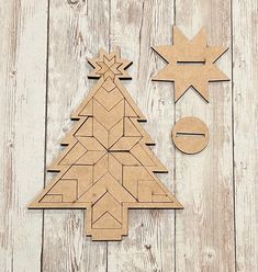 a wooden cutout of a christmas tree next to another cutout of a star