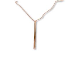 A minimalist vertical rose gold bar and delicate metallic chain combine to create this Vertical Long Bar Charm Necklace on rose gold chain, your new favorite wear-anywhere accessory. This charm necklace can be paired with any look, providing that extra touch of timeless style. Make this Charm Necklace a staple in your wardrobe and you will not be disappointed. rose gold chain rose gold lobster clasp 2 inch rose gold bar 16 and 18 inch necklace lengths custom necklace lengths available Everyday Rose Gold Necklace With Rectangular Pendant, Minimalist Rose Gold Necklace With Rectangular Pendant, Minimalist Rose Gold Bar Necklace For Everyday, Minimalist Rose Gold Bar Necklace As Gift, Minimalist Rose Gold Bar Necklace For Gift, Rose Gold Bar, Rose Gold Chain, Gold Bar, Rose Gold Necklace