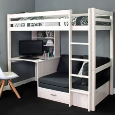 a white bunk bed sitting next to a desk with a computer on top of it