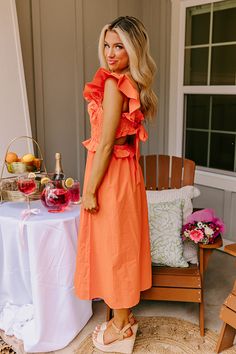 - You will look like a coastal cutie in this darling dress! - Unlined, lightweight material - A square cut neckline - Flutter sleeves - A smocked bodice - A back with tie closure and cutout detail - A waistline with a ruffled accent and back elastic detail - A flowy, yet flattering silhouette that ends in a straight midi length hemline Beach Dresses With Ruffle Sleeve And Smocked Back, Beach Dresses With Smocked Back And Ruffle Sleeve, Flutter Sleeve Dresses With Smocked Back For Day Out, Ruched Beach Dress With Ruffle Sleeves, Picnic Dress With Smocked Back And Ruffled Straps, Brunch Dress With Tie Back And Ruffle Sleeves, Vacation Dress With Smocked Back And Flutter Sleeves, Summer Dresses With Ruffle Sleeve And Smocked Back, Summer Dresses With Smocked Back And Ruffle Sleeve