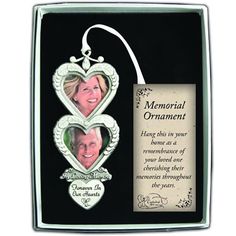 a memorial ornament with two hearts in it