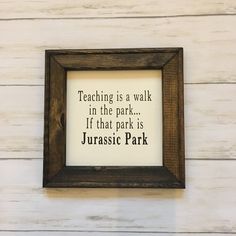 a wooden frame with a quote on it that says teaching is a walk in the park