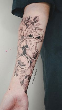 a person with a flower tattoo on their arm