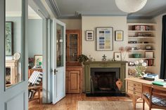 a living room filled with furniture and a fire place