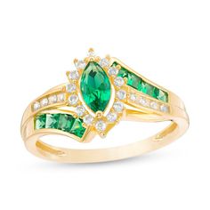 Complement her dressy attire with this show-stopping gemstone and diamond ring. Fashioned in warm 10K gold, this resplendent style features a 7.0 x 3.5mm marquise-shaped verdant-green emerald wrapped in a frame of sparkling diamonds. Rich channel-set princess-cut emeralds and shimmering round diamonds artfully adorn the sculpted bypassing ribbons of the split shank. Radiant with 1/6 ct. t.w. of diamonds, this ring is buffed to a brilliant luster. Formal May Birthstone Diamond Ring With Center Stone, Formal Emerald Birthstone Ring With Center Stone, Formal Emerald Cluster Ring With Accent Stones, Emerald Birthstone Ring With Halo Setting For Formal Events, Emerald Birthstone Ring With Halo Setting For Formal Occasions, Marquise Emerald Ring For Promise, Formal Emerald Birthstone Ring With Diamond Accents, Formal Emerald Birthstone Ring With Halo Setting, Marquise Emerald Promise Ring With Center Stone