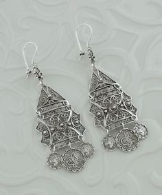 Handmade Silver Ornate Ottoman Filigree Earrings 925 Sterling Silver Large Dangle Lace Earrings Artisan Made Handcrafted, One of a Kind Delicate Earrings, Anniversary gift, vintage earrings, antique earrings, ottoman earrings jewelry, tugra earrings Material: 925 Sterling Silver (NICKEL FREE) Earrings Length and Width: 8.5cm X 2.6cm // 3.35 Inch X 1 Inch These gorgeous vintage earrings are made of handwoven silver filigree, with a beautiful ornate tugra design. They're one of a kind and would ma Handmade Fusion Style Ceremonial Earrings, Silver Fusion Chandelier Earrings For Wedding, Silver Fusion Style Wedding Chandelier Earrings, Traditional Handmade Sterling Silver Chandelier Earrings, Traditional Sterling Silver Chandelier Earrings, Traditional Sterling Silver Chandelier Earrings With Intricate Design, Traditional Sterling Silver Nickel-free Chandelier Earrings, Traditional Nickel-free Sterling Silver Chandelier Earrings, Handmade Silver Fusion Chandelier Earrings