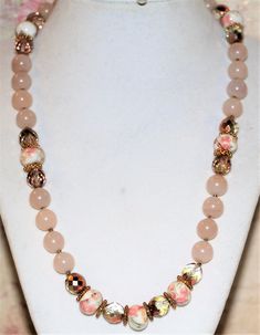 This necklace is made with hand painted ceramic beads, peach stone beads and czech peach ab glass beads with gold filigree findings, copper seed beads and a hook closure. This is a very beautiful necklace learning toward the Victorian Era. It is very beautiful on too. I am a SARJD #3614, (self-representing artist in jewelry design) and all of my designs are OOAK, (one of a kind). All items will be packaged in a box for jewelry and wrapped in bubble wrap then a bubble mailer for extra security an Peach Beaded Necklaces With Round Beads As Gift, Vintage Pink Beaded Necklace With Round Beads, Vintage Pink Faceted Bead Necklaces, Vintage Pink Faceted Beaded Necklaces, Peach Beaded Necklaces With Round Beads, Box For Jewelry, Light Amethyst, Amethyst Gold, Hand Painted Ceramic