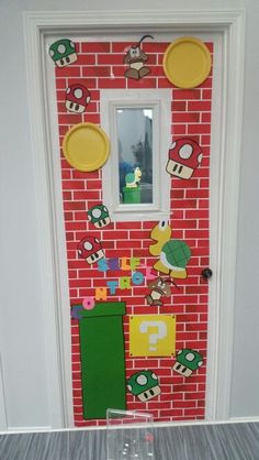 the door is decorated with mario and luigi's name on it, as well as other decorations