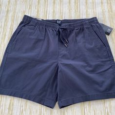 Men’s Gap Pull On Shorts Size Xl. New With Tags! Navy Blue Color. Elastic Waste With Drawstring. Two Front Pockets With Single Button Pocket On Back. Approx 19” In Length With 7” Inseam. 98% Cotton And 2% Spandex Material. Gap Casual Blue Shorts, Casual Blue Gap Shorts, Blue Gap Shorts With Pockets, Grey Chinos, Gap Men, Pull On Shorts, Khaki Chinos, Preppy Casual, Gap Shorts