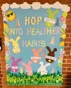 a bulletin board that says, hop into healthier habitts with bunnies on it