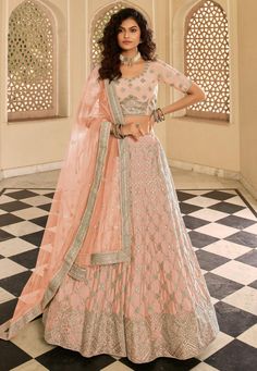 Peach crepe embroidered lehenga choli 7247  Desc:  Style : Party Wear Lehengas Color : Peach Fabric : Crepe Work : Embroidery Wash Care : Dry clean Sleeve Style : Half Sleeve Long Sleeves : Done only in Custom Stitch Sleeves Lining : Done only in Custom Stitch Bust Size : 32 to 42 Inches Occasion : Wedding   Festival   Mehendi   Sangeet   Engagement   Reception   Ceremonial   Baby Shower Mirror. With Express Free Shipping and Custom Stitching, Buy Indian Wedding Party Wear Lehenga Peach crepe em Peach Crepes, Peach Lehenga, Designer Bridal Lehenga Choli, Organza Lehenga, Work Lehenga, Designer Bridal Lehenga, Choli Designs, Lehenga Choli Online, Embroidered Lehenga