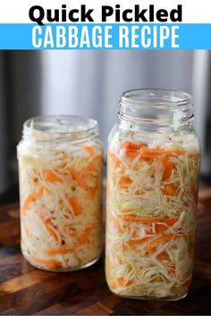 two mason jars filled with shredded carrots and cabbage