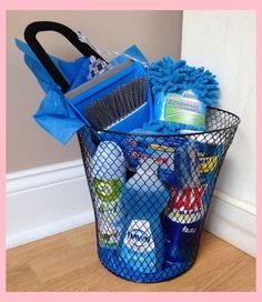 a bucket full of cleaning supplies sitting on the floor