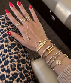 Discover the perfect blend of sophistication and style with this gold luxury bracelet set. The nail and clover designs add a unique aesthetic, making it a must-have accessory for any occasion. Cartier Nail Bracelet, Nail Bracelet