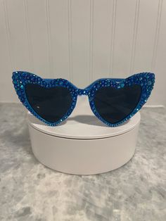 Kids sunglasses crafted with premium glass blue aurora borealis rhinestones and industrial strength adhesive.  Dimensions- 5 in wide across lens and 5 in long down arm Blue Glass Sunglasses For Party, Blue Glass Party Sunglasses, Blue Aurora Borealis, 17th Birthday Ideas, Rhinestone Sunglasses, Blue Sunglasses, Kids Sunglasses, Blue Heart, Blue Rhinestones