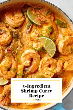 a pan filled with shrimp curry and garnished with limes