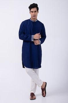 Navy bam silk kurta with mirror embroidered collar and cuffs. Comes with ivory cotton silk pyjama. - Aza Fashions Long Sleeve Kurta With Embroidered Cuffs For Eid, Eid Long Sleeve Kurta With Embroidered Cuffs, Designer Embroidered Cuff Kurta For Eid, Festive Cotton Kurta With Embroidered Cuffs, Traditional Designer Kurta With Embroidered Cuffs, Blue Cotton Silk Long Sleeve Sherwani, Festive Kurta With Embroidered Cuffs, Traditional Wedding Kurta With Embroidered Cuffs, Blue Long Sleeve Kurta In Raw Silk