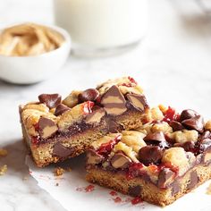 two pieces of dessert sitting on top of a table