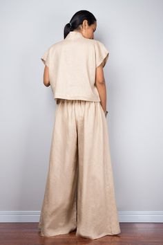 "Linen pants, Handmade natural linen long wide leg palazzo pants. Beige brown high waist women's summer pants Made with the highest care this beautifully crafted garment will fit you perfect thanks to the elastic strap on the back. I like wearing this one when sitting in the garden reading a book and dream away. Soul of the Orient Collection - Original Design & Produced by NUICHAN PRODUCT SIZE : One Size Fits Most * Waist : elastic round waistband up to 26 - 38\" * Hips : (max 40\") if your Brown Linen Wide Leg Bottoms, Brown Linen Wide Leg Pants For Spring, Spring Brown Linen Wide Leg Pants, Brown Wide Leg Linen Bottoms, Wide Leg Flax Pants For Summer, Brown Wide Leg Linen Pants, Brown Linen Relaxed Fit Wide Leg Pants, Brown Linen Wide-leg Pants, Brown Linen Wide Leg Pants