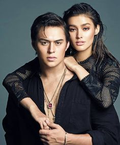 an image of a man and woman posing for a magazine cover photo together, with one holding his arm around the other's shoulder