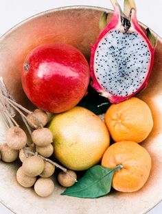 a bowl filled with different types of fruit