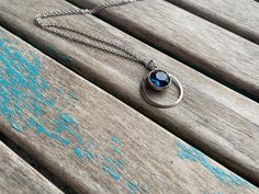 This lovely stainless steel and deep turquoise  blue crystal drop, with added circle, makes for a great, modern, simple necklace. The drop measures approximately 1 inch in length and is strung on your choice of chain. READ BELOW FOR ANSWERS TO COMMONLY ASKED QUESTIONS: Q: Can I include a note in the package so that I can send it directly as a gift? A: Absolutely, it's no problem at all to include a short note for you in the package. Just type me a quick note during checkout of what you want the Short Note, Deep Turquoise, Bleu Turquoise, Crystal Drop, Simple Necklace, Drop Necklace, Blue Crystals, Turquoise Blue, Charm Necklace