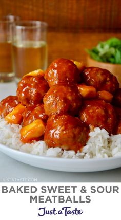 baked sweet and sour meatballs with rice on a plate next to a glass of water