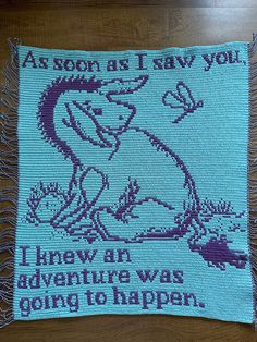 a cross - stitch pillow that says, as soon is saw you i knew an adventure was going to happen