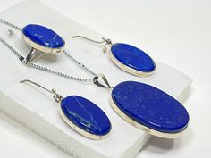 Lapis Lazuli raw stone inlaid into 925 sterling silver oval locket, ring, and earrings.  Lapiz Lazuli is believed to offer protection to the wearer, as well as attract good luck and wealth. *You can also purchase only the ring, necklace, or earrings. Oval Lapis Lazuli Silver Jewelry, Oval Silver Lapis Lazuli Jewelry, Silver Jewelry With Oval Lapis Lazuli, Valley City, Locket Ring, Lapis Lazuli Jewelry, Oval Locket, Raw Stone, Ring Necklace