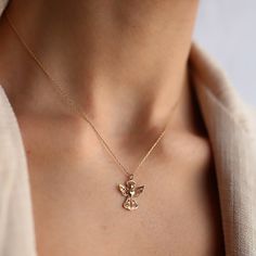 14K Gold Lace Detail Angel Pendant:  This beautiful 14K gold angel pendant has a minimalist design with a stunning lace detail, making it a classic and unique piece for jewelry lovers of all ages. Whether you wear it on its own or layered with other chains, this will be a staple in any collection. It's the perfect gift for someone special in your life! Materials & Specifications:  -14K real gold chain and pendant -Pendant dimensions are 1.4cm (w) x 1.5cm (h) Available in Yellow gold, Rose gold, Real Gold Chains, Gold Angel, Real Gold Jewelry, Angel Necklace, Gold Chain With Pendant, Angel Pendant, Luck Charm, Jewelry Show