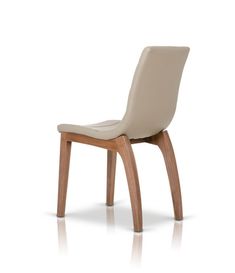 an upholstered chair with wooden legs and a leather seat pad on the back