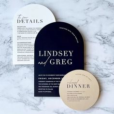 wedding stationery and menus on marble table with black paper, gold foil lettering