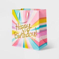 a colorful shopping bag with the words happy birthday on it's front and bottom