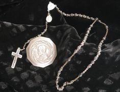 "Vintage silver plated religious Catholic rosary case bearing a portrait of Pope Pius XII. Repousse style decoration on the lid. Pope Pius XII was the leader of the Catholic faith from March of 1939 to October 1958. Inside the case is a rosary of wood beads and metal, the crucifix also being inlaid with wood. Please review all photos as these are part of our description. DIMENSIONS: overall approx. 1.75\"Dia AGE: Vintage, early 20th C. CONDITION: Wear typical for age and use. Some dings to the box as well as wear to the finish. Imperfections to the rosary including wear to the finish of the wood beads and the metal components. Hinge is in good condition but the lid does not lock down. This piece has not been polished and retains the patina with which it came to us.  ORIGIN:  Italian, possi Antique Silver Rosary For Gift, Pius Xii, Pope Pius Xii, Rosary Case, Catholic Rosary, Rosary Catholic, Catholic Faith, Rosary, Wood Beads