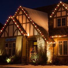 a house with christmas lights on it's roof