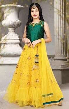 Are you looking for an elegant yet glamorous outfit for your princess for the upcoming party? Take a pick for this one and you'll not regret. This Lehenga Choli set comes in lovely green hue and has embroidery work on the Lehenga. The Lehenga is plain suitable for festival and party wear. Size Age Shoulder Chest Waist 30 Size 8-9Y 11 24 30 32 Size 9-10Y 11.5 24 30 34 Size 10-11Y 12.5 24 32 36 Size 12-13Y 12.5 24 34 38 Size 13-14Y 14 26 36 40 Size 14-15Y 13.5 26 36 Sleeveless Embroidered Party Dress, Embroidered Sleeveless Party Dress, Sleeveless Dress With Dori Work For Eid, Yellow Princess Wedding Gown, Yellow Gown For Spring Wedding, Spring Yellow Wedding Gown, Yellow Spring Wedding Gown, Yellow Sleeveless Set For Eid, Yellow Sleeveless Wedding Sets