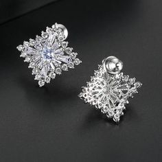 Material: Copper, Rhodium Plated, Cubic ZirconiaSize: 1.7cm by 1.7cmWeight: 3.6g per pairDesign: Crystal Square Diamond Shaped Stud Earrings Color: White, Silver Formal Cubic Zirconia Flower Drop Earrings, Formal Flower Earrings With Cubic Zirconia, Formal Flower Earrings With Sparkling Cubic Zirconia, Formal Flower Earrings With Sparkling Stones, Silver Cubic Zirconia Flower Earrings For Party, Diamond White Pierced Party Earrings, White Gold Cubic Zirconia Crystal Earrings For Pierced Ears, White Gold Cubic Zirconia Flower Earrings For Formal Occasions, Silver Sparkling Flower Earrings For Formal Occasions