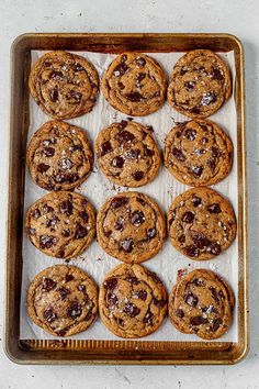 chocolate chip cookies on a baking sheet ready to be baked in the oven for christmas