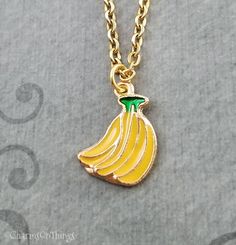 Bananas Necklace Banana Bunch Charm Necklace Banana Pendant | Etsy Yellow Metal Necklace As Gift, Yellow Metal Necklace For Gift, Nickel-free Novelty Pendant Necklaces, Novelty Nickel-free Pendant Necklace, Nickel-free Novelty Pendant Necklace, Novelty Gold Pendant Jewelry, Yellow Dangle Necklaces As Gifts, Gold Novelty Dangle Jewelry, Yellow Jewelry With Adjustable Chain