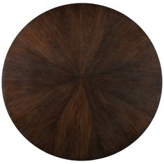 a round wooden table with dark brown wood grains