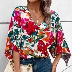 Relaxed Fit Multicolor V-neck Top, Multicolor V-neck Top For Spring, Red Printed V-neck Shirt, Fall Multicolor V-neck Shirt, V-neck Floral Print Relaxed Fit Shirt, Red V-neck Shirt For Vacation, Vacation Red V-neck Shirt, Chic Multicolor V-neck Shirt, Relaxed Fit V-neck Blouse For Brunch