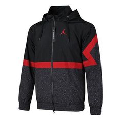 Nike Jordan Black/Red Jacket Drawstring Hooded Outerwear For Sports Events, Sports Outerwear With Drawstring Hood, Breathable Black Windbreaker For Winter, Sports Season Outerwear With Drawstring Hood, Black Breathable Long Sleeve Windbreaker, Hooded Waterproof Track Jacket For Winter, Winter Waterproof Hooded Track Jacket, Black Waterproof Track Jacket For Sports, Waterproof Hooded Track Jacket For Winter