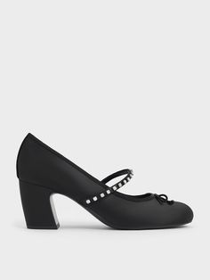 These satin Mary Jane pumps offer a refreshing take on the classic style. Inspired by elegant ballet slippers, this pair features crystal-studded straps across the vamps, alongside dainty knotted bows. The neat, mid-height block heels offer a stature boost without sacrificing comfort. In black, they offer great style mileage and will pair well with most outfits. Perfect for evening events and date nights, they can also be dressed down to suit off-duty, weekend looks. Ballet Slippers, Mary Jane Pumps, Charles Keith, Black Textures, The Vamps, Dressed Down, Mary Janes, Block Heels, Date Night